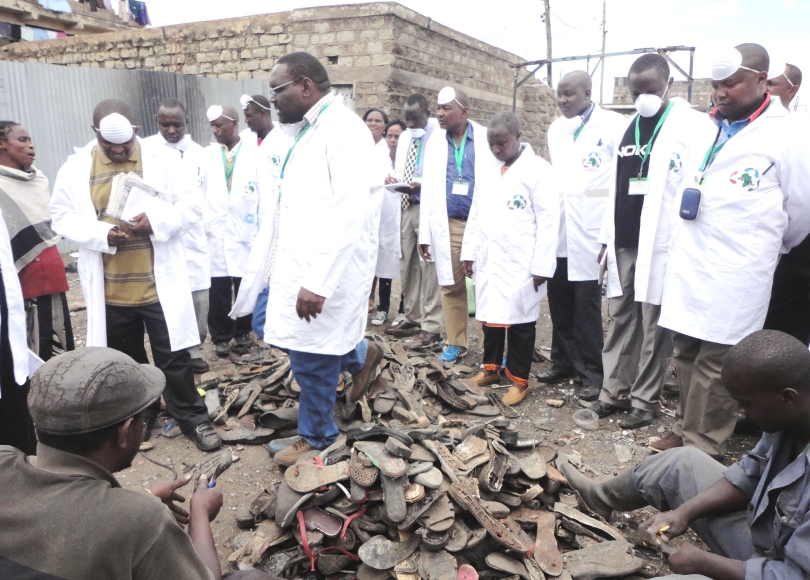 Pro.Kibwage giving a brief in regards to the shoe recovery activity at the dandora dumpsite